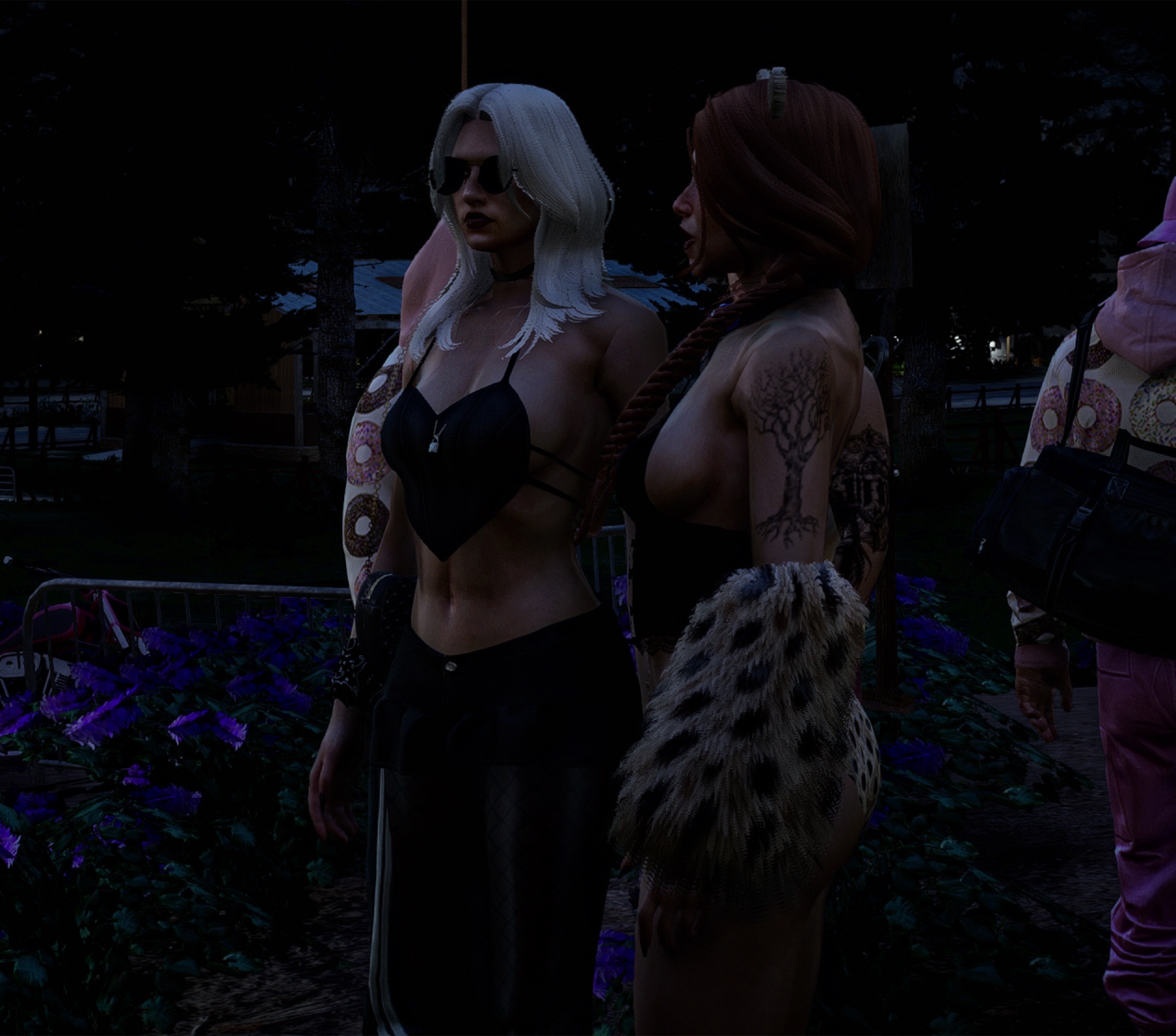 Two attendees posing together at night