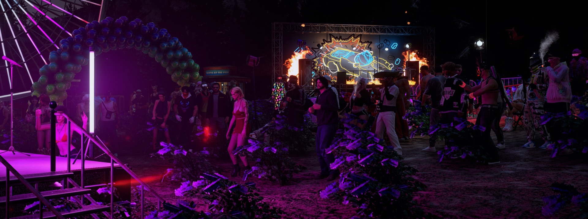 Wide night view of the grounds, Ferris wheel and main stage