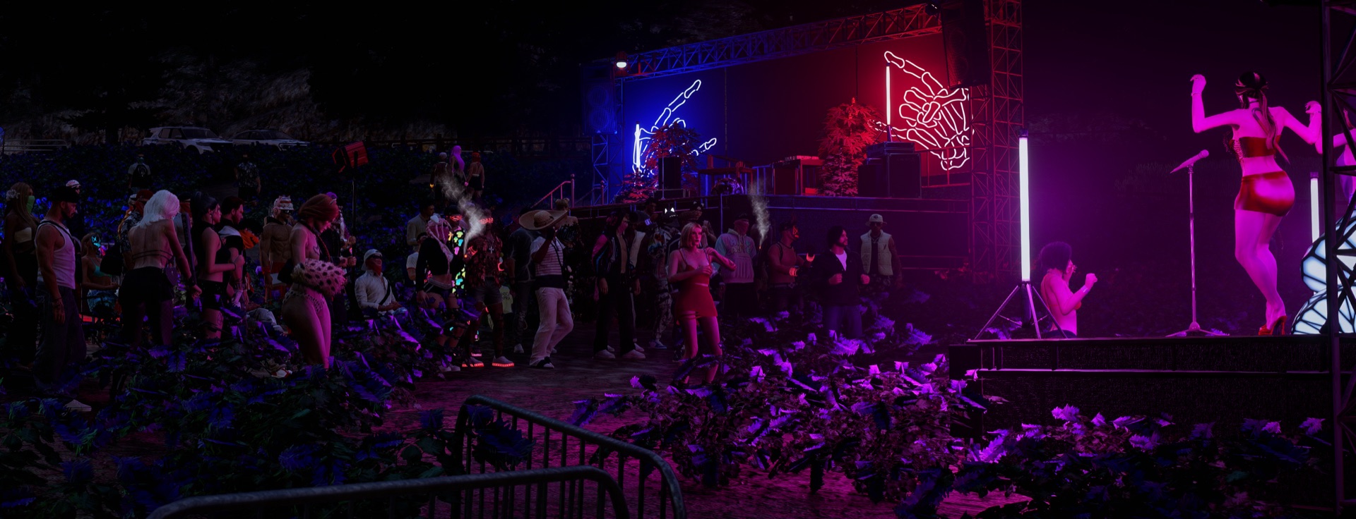 A performer on the twin neon-hand stages in front of the crowd