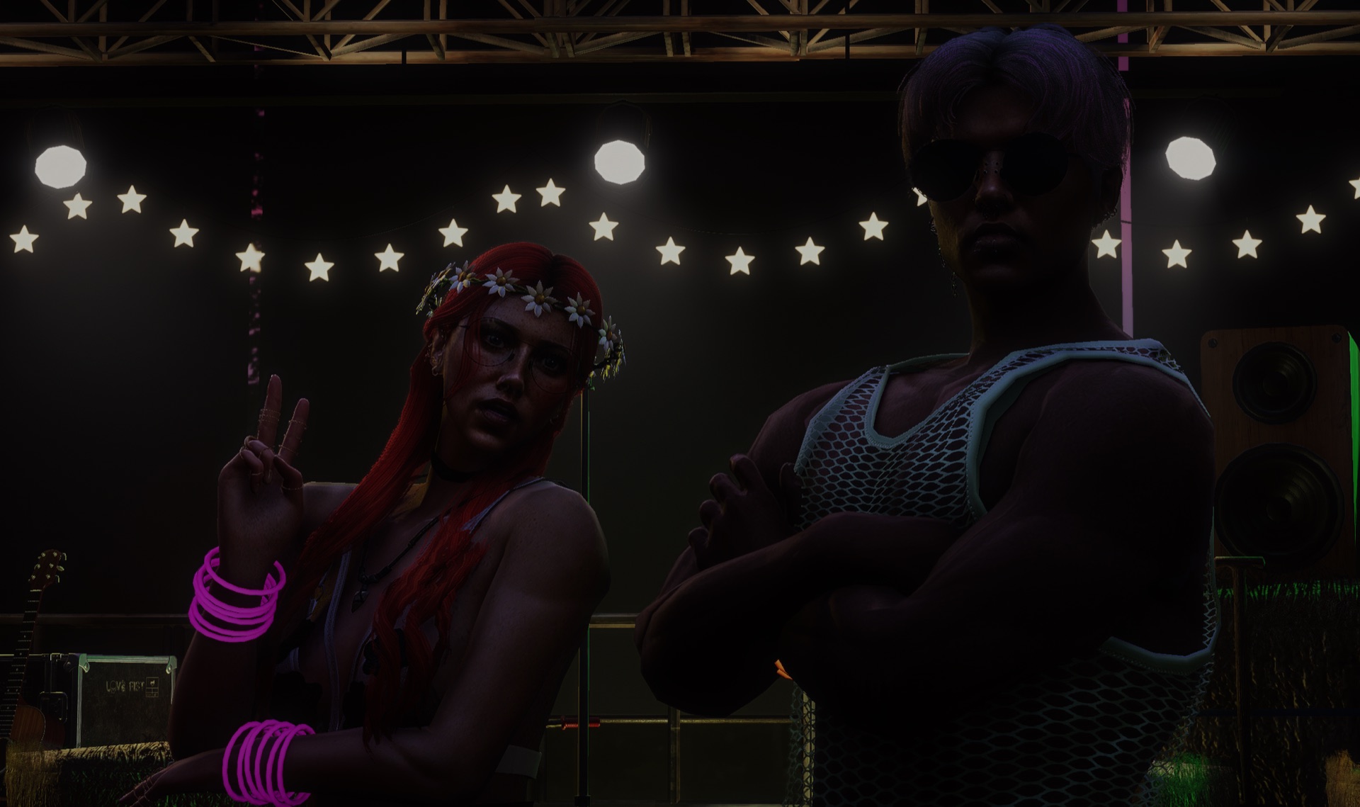 Two attendees posing under the star lights