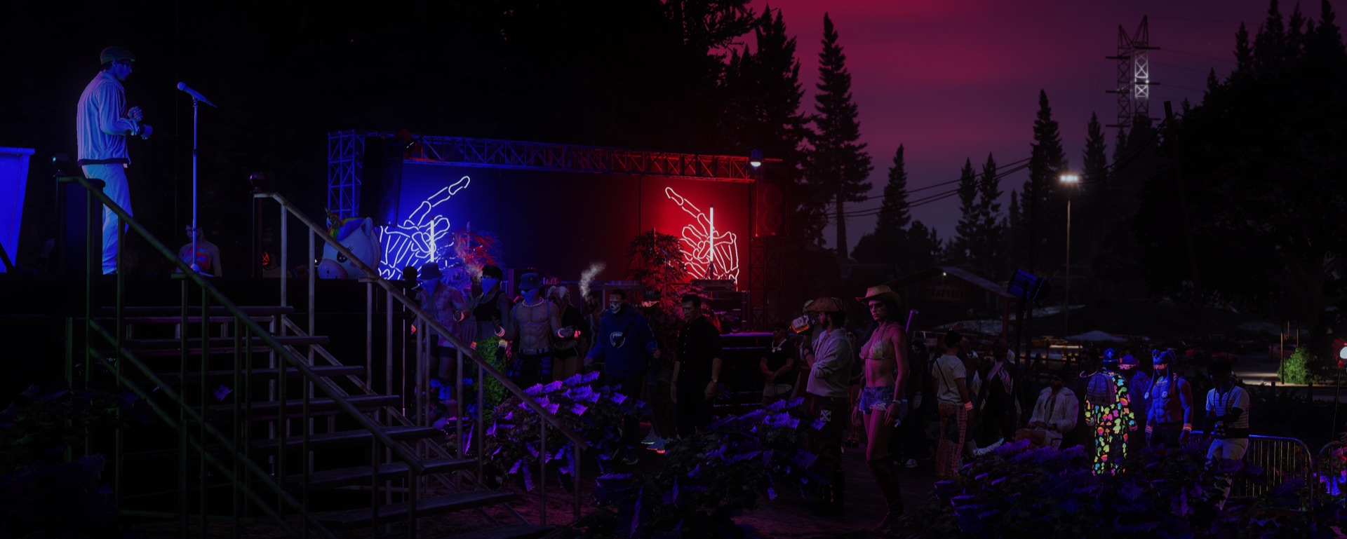 The red and blue hand stages with the night crowd