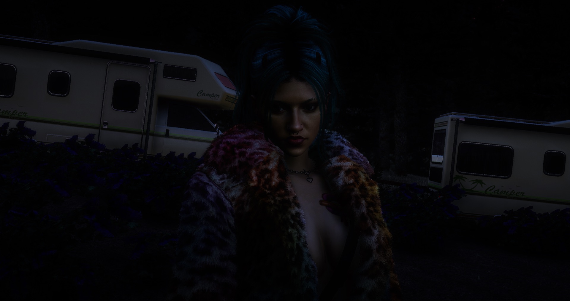 An attendee by the campers at night