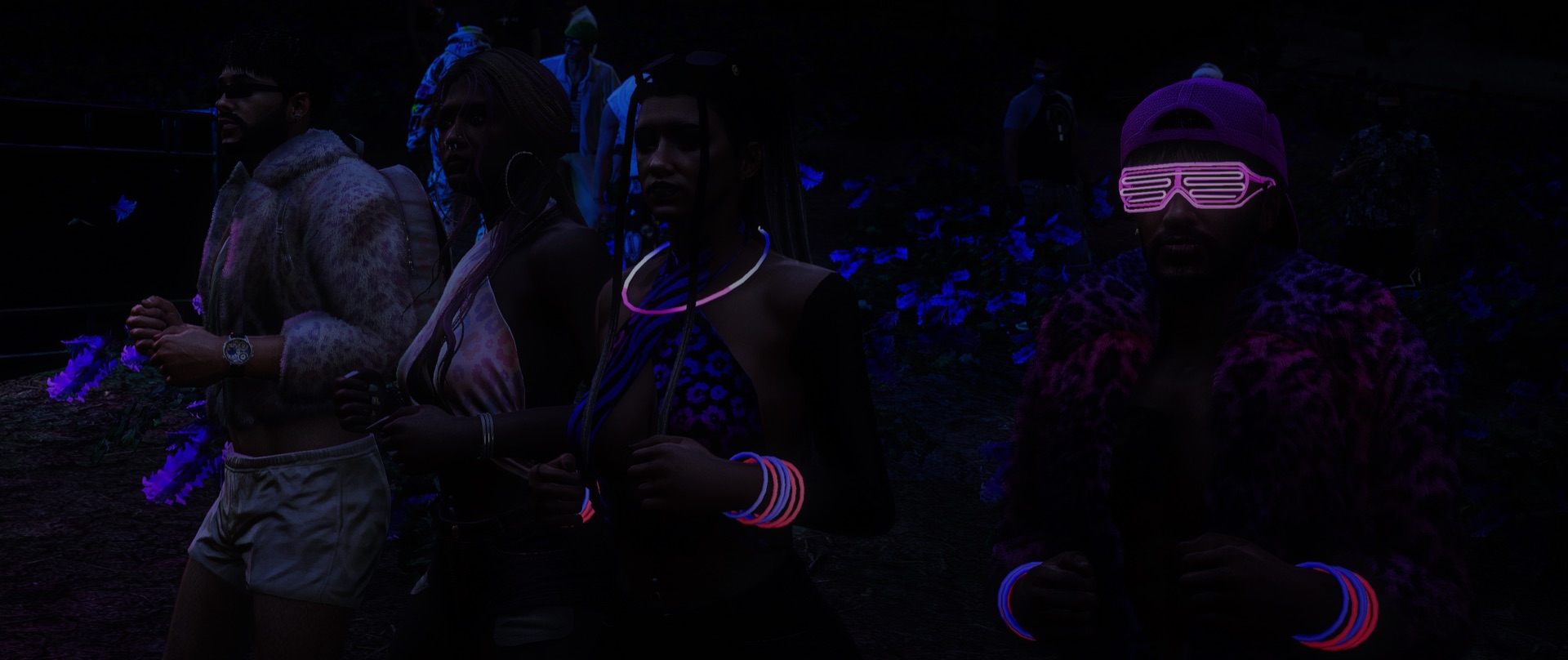 Friends walking the grounds in neon glow gear