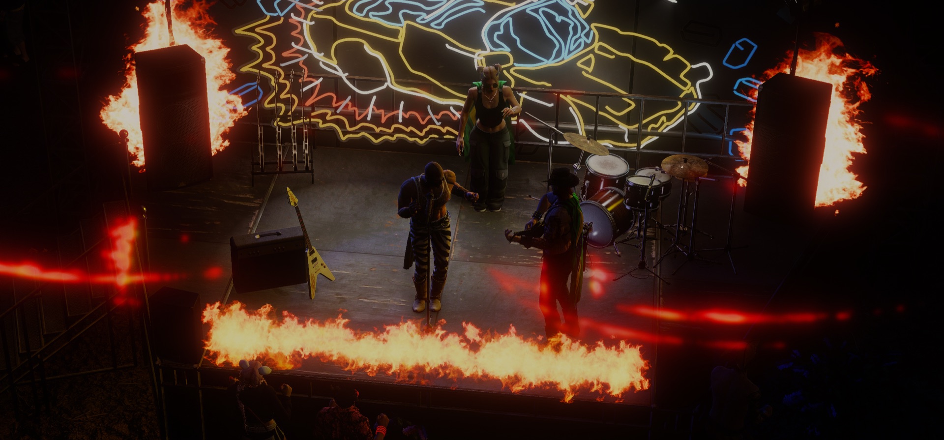 A band playing through a wall of stage fire